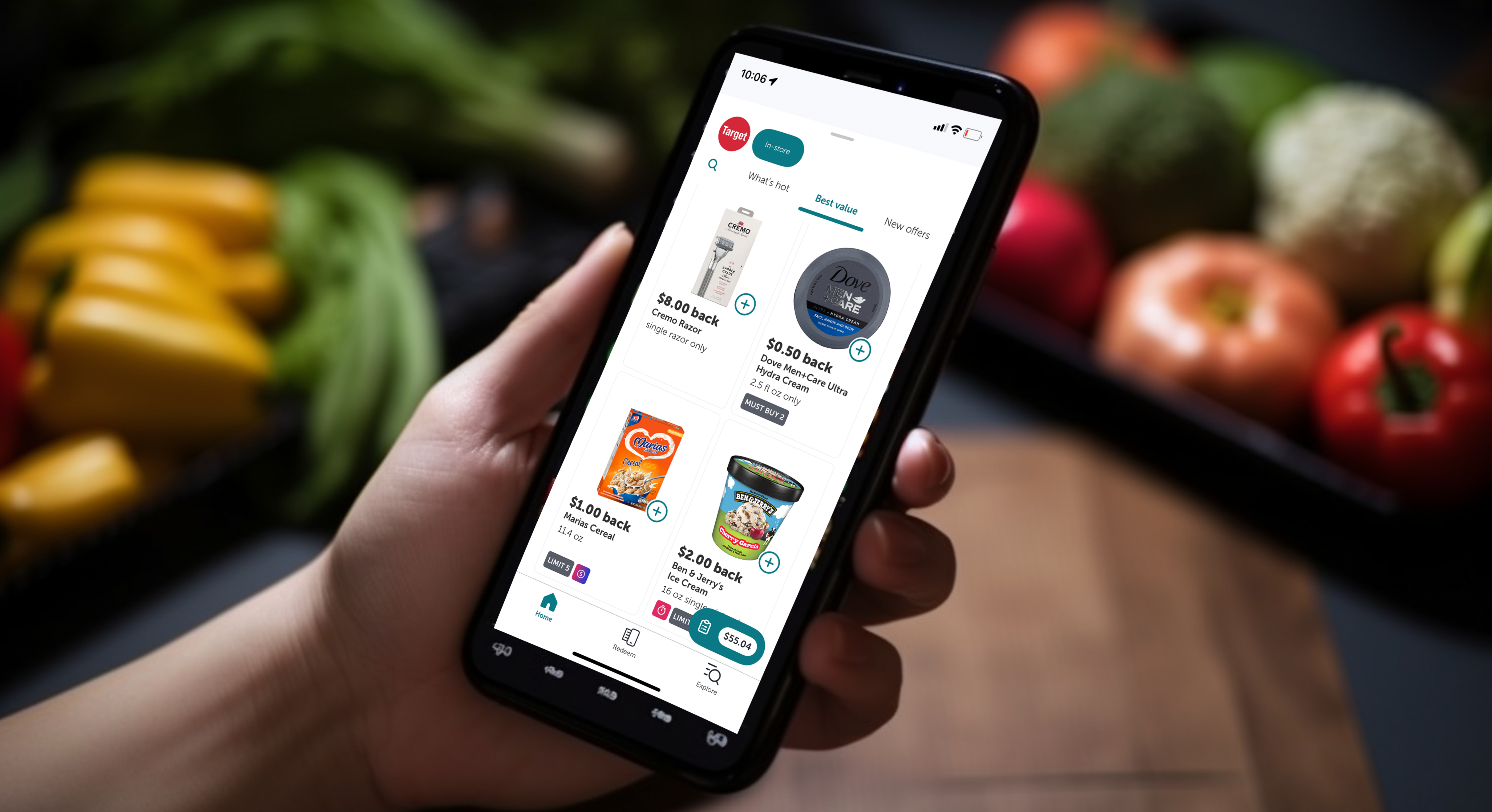 A phone with a rebate app open being held in someone's hand.