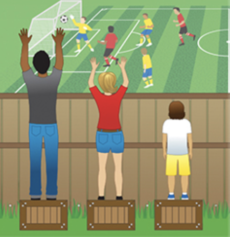 Kids watching a soccer game in front of a wooden fence. Each person is standing on a wooden box at equal heights, allowing them to all see over the fence. 